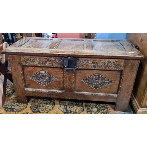 1356 - Oak coffer with carved channel decoration to the top, carved front and stile supports