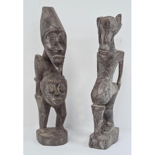 161 - African carved Grebo figure with one eye, 32cm high and another carved African figure with two heads... 