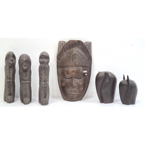 163 - Carved African mask, carved monkeys 'See No Evil, Hear No Evil and Speak No Evil' and two carved Afr... 