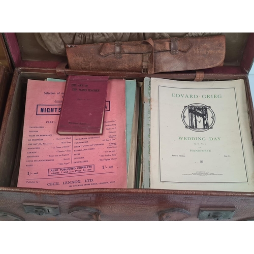 199 - Leather suitcase with various music sheets and a leather suitcase with dressing travelling set to in... 