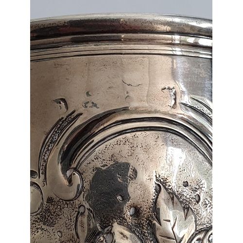 447 - 18th century silver mug with later repousse decoration, scroll and floral, all marks worn, 12.2oz or... 