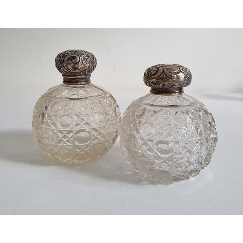 461 - Pair of early 20th century silver lidded and glass circular cut glass scent bottles, the silver circ... 