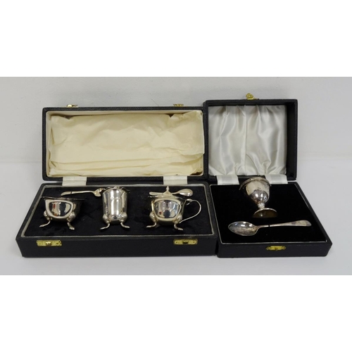 486 - 1930's silver cased three-piece cruet set with two spoons, Sheffield 1939, makers E&H, 4.7oz and a c... 