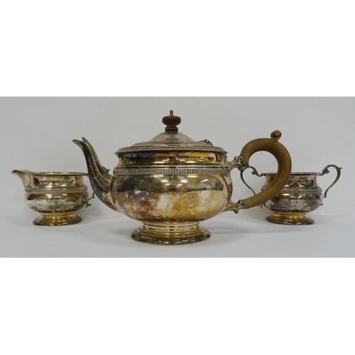 494 - 1940's silver teapot, matching milk jug and two-handled sugar bowl with wooden finial and handle, ga... 