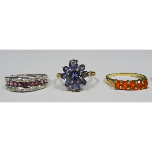 553 - 9ct gold, blue stone and diamond dress ring, the oval cluster blue stones with small diamonds to the... 