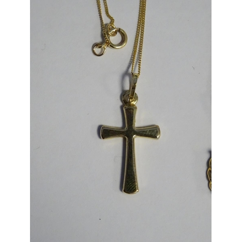 579 - 9ct gold crucifix on 9ct gold chain, a pair of 9ct gold hoop earrings, another gold hoop earring and... 