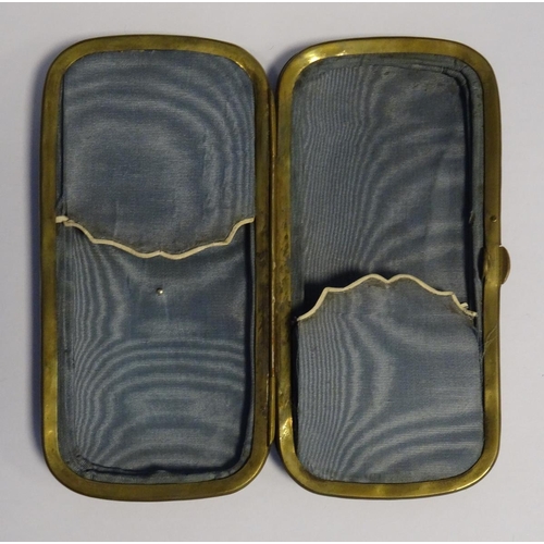 586 - Tortoiseshell and silver inlaid glasses case with silver shield to lid (tortoiseshell cracked)