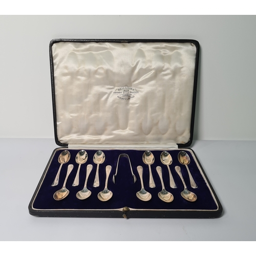 467D - Set of 12 silver-handled teaspoons, hanover pattern and matching sugar nips, London 1926/1927, cased