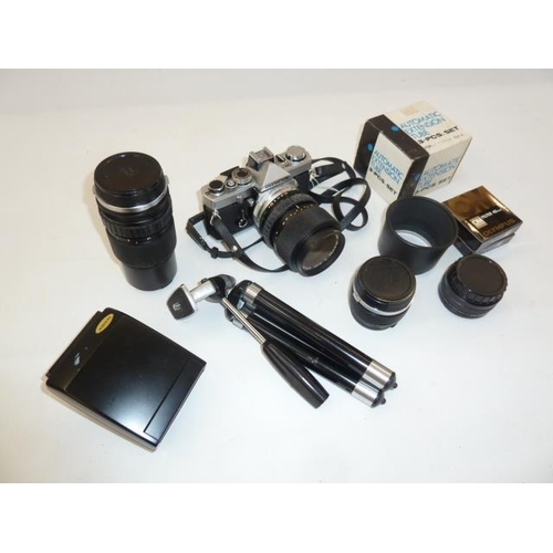 159 - Olympus OM-1 camera with four lenses, an electronic flash, filters, auto-zoom and instruction manual... 