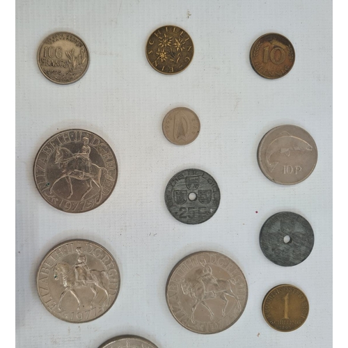 214 - An undated 20p coin and a small quantity of English and foreign coins in tin