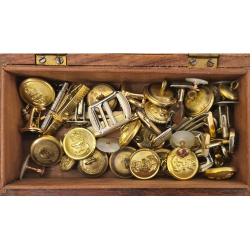 229 - A small quantity of military badges and buttons in wooden box and a RAF Benevolent Fund bell