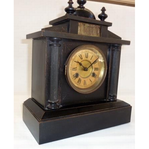 268 - A 20th Century ebonised wooden mantel clock, with frieze decorated with figures, Roman numeral dial,... 