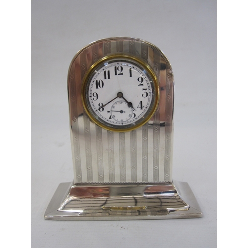 297 - 1930s silver rectangular cigarette case initialled BCF, 2oz, a silver mounted mantel clock, a silver... 