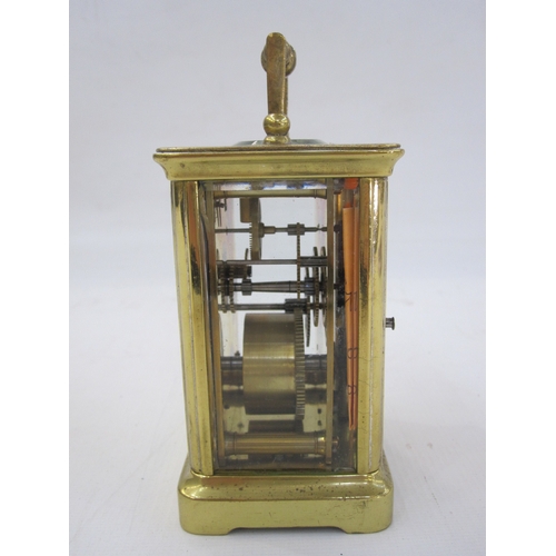 298 - A French carriage clock, Roman numeral enamel dial, 10.5cm high not including handle