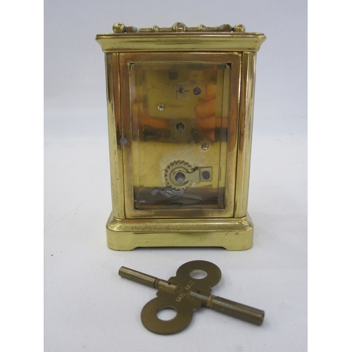 298 - A French carriage clock, Roman numeral enamel dial, 10.5cm high not including handle