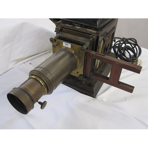 168 - A Victorian magic lantern, black cold painted lid, wooden with adjustable viewing lens on plinth bas... 