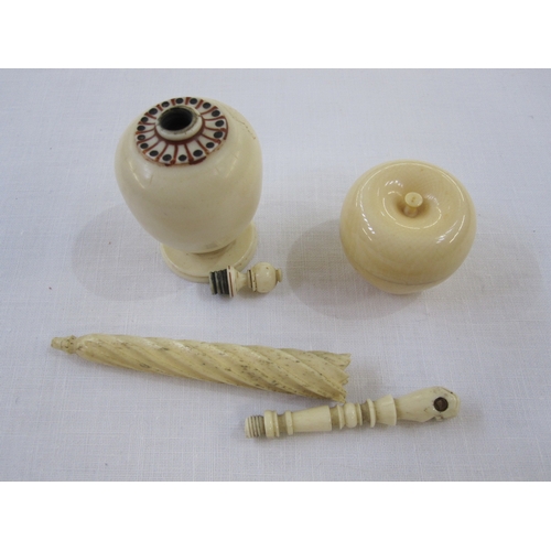 282 - A miniature ivory ink well, bulbous urn shaped, twist finial, with red and black staining to neck on... 