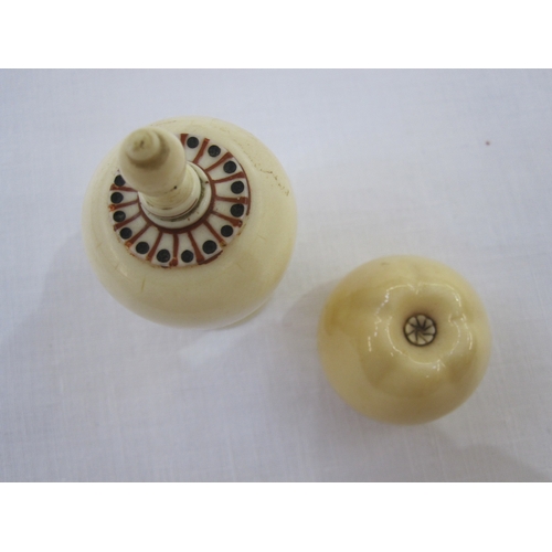 282 - A miniature ivory ink well, bulbous urn shaped, twist finial, with red and black staining to neck on... 