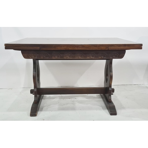 1072 - 20th century oak rectangular extending dining table on trestle-style base