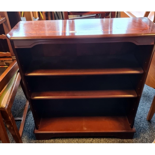 1094 - Modern mahogany and banded open bookcase on bracket feet, 74.5cm x 85cm