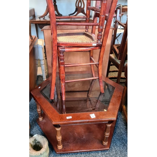 1097 - Hexagonal two-tier coffee table and two cane-seated chairs and a cast stone shoe (4)