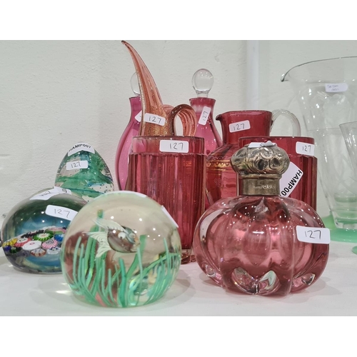 127 - Four paperweights, a pair of cranberry small decanters, a Murano cranberry and gold jug with pointed... 