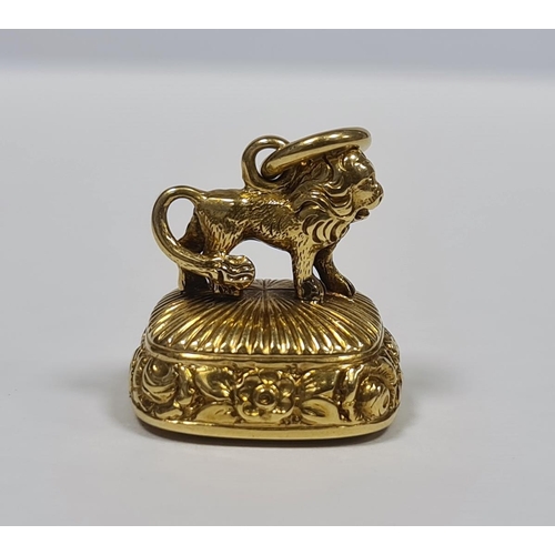 238 - Small Georgian gold seal, rounded oblong, ribbed and floral, the mount in the form of a lion and ins... 