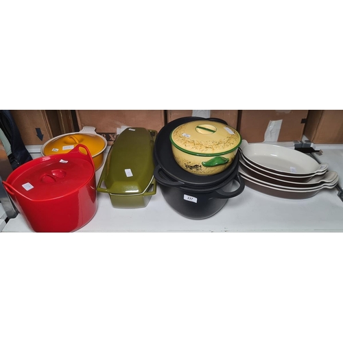 337 - Various Le Creuset and other cast iron casseroles in orange, red, green and black, five graduated ea... 