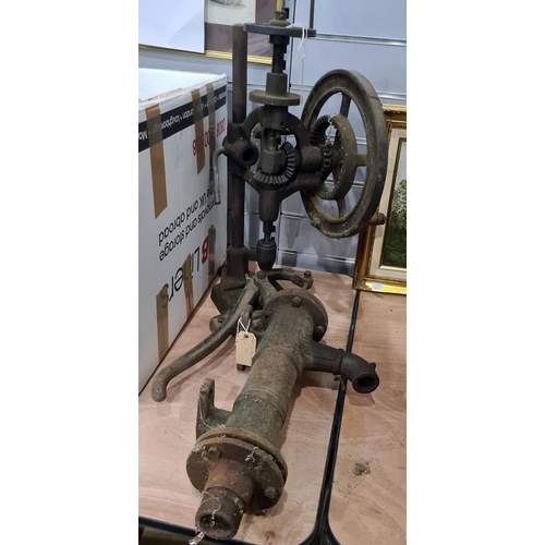 413 - Old hand-cranked pillar drill and a cast iron water pump