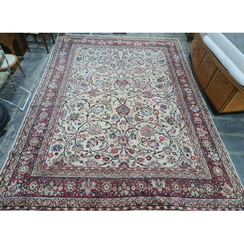 1039 - Cream ground Eastern-style rug with allover foliate design, red ground and stepped border, 400cm x 2... 