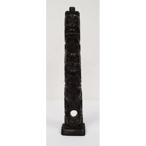 164 - Haida-style carved argillite totem pole carved with three crouching figures, 42cm high (broken in tw... 