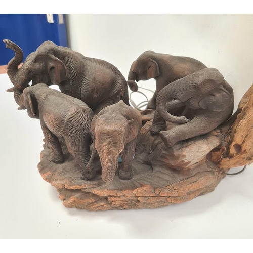 184 - Statement table lamp constructed from driftwood and with a family of carved wooden elephants, approx... 