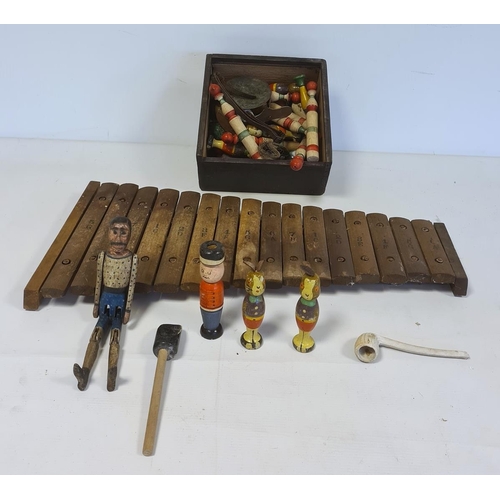 526 - Wooden xylophone, wooden jointed figure of a man, wooden skittles, marbles and miniature child's cer... 