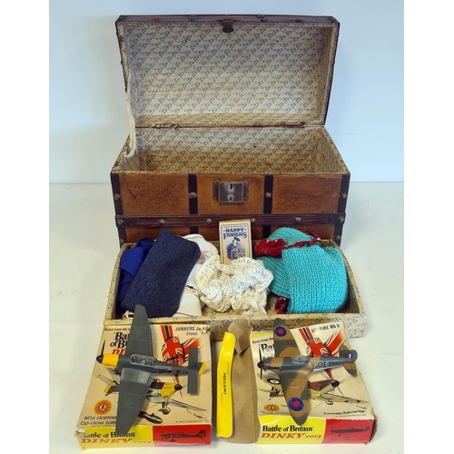 528 - Child's bound chest with lift-out compartment containing small collection of doll's clothes, ribbons... 