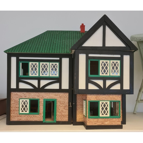 531 - 20th century doll's house in the Tudor style with various 20th century doll's house furniture and to... 