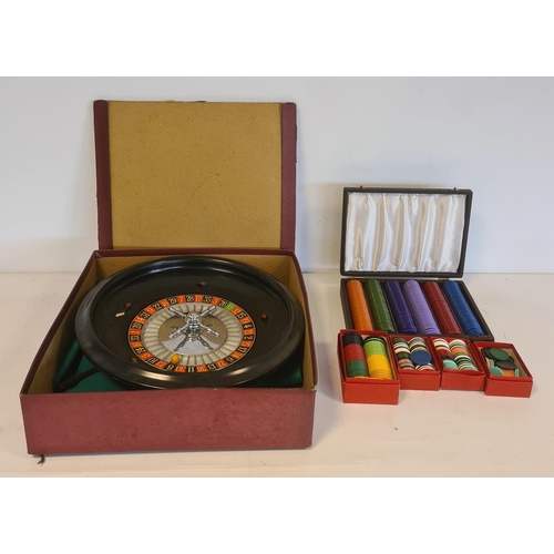 532 - Roulette wheel with various counters and green cloth, boxed and separate box for extra counters (2 b... 