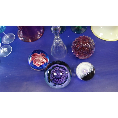 101 - Four assorted paperweights to include Caithness 'Optics' R588, assorted coloured wines, two glass be... 