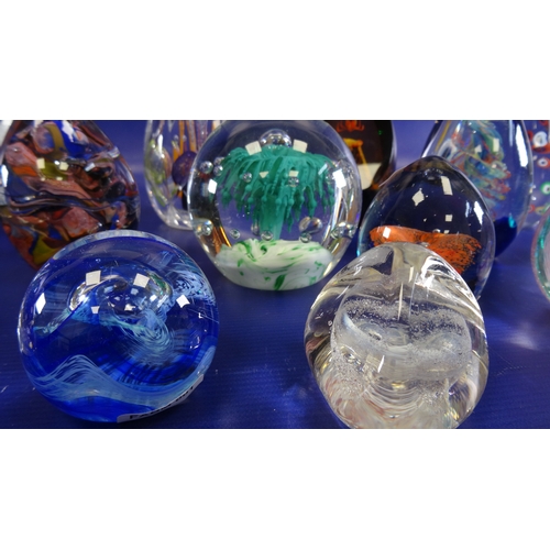 105 - Assorted glass paperweights to include Caithness 'Cauldron', Caithness 'Pebble', Caithness 'Cascadia... 