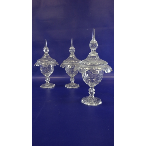 96 - Set of three 19th century cut glass sweetmeat jars with covers, pointed finials , waisted stem on oc... 