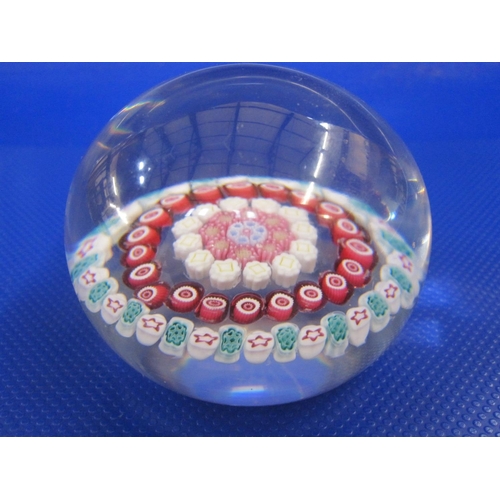 134A - Baccarat paperweight, millefiori decorated with five rings of coloured canes, 6.5cm diameter, with e... 