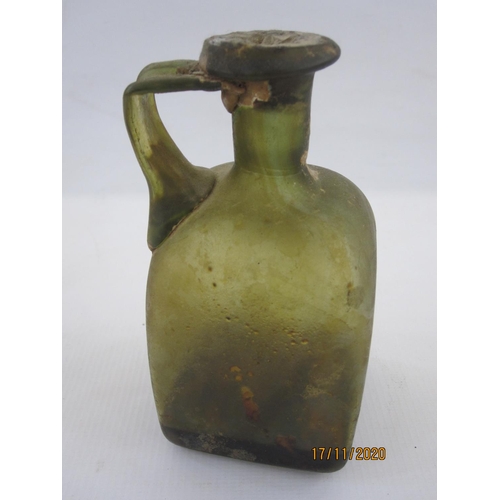 147 - Roman glass unguent flask of square form with single handle, the neck with seal, 13cm high and with ... 