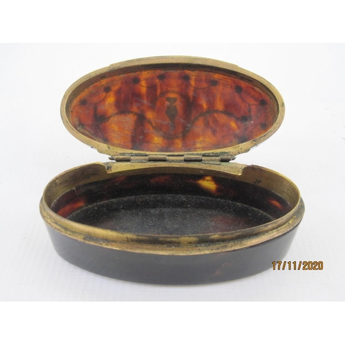 158 - George III tortoiseshell box of oval form, the hinged cover with silver pique work, wirework border ... 