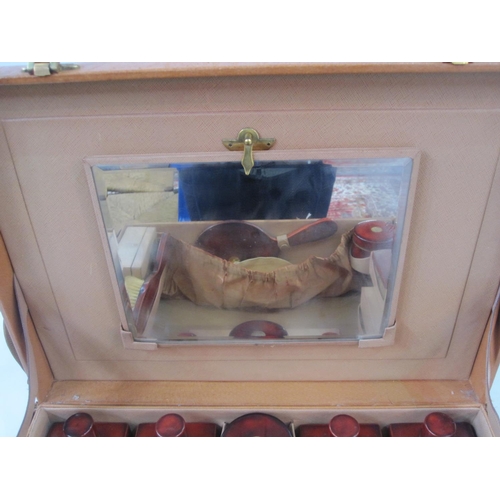 166 - Circa 1930's leather vanity case opening to a leather interior, enclosing red lacquer and inlaid gil... 