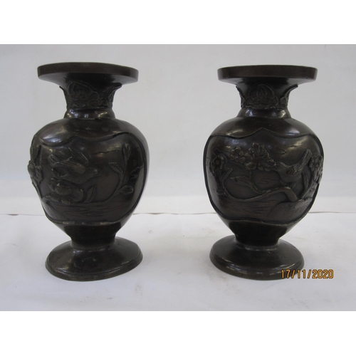 178 - Pair of Japanese Meiji period Yoshida made bronze vases, ovoid bodies embossed in high relief with b... 