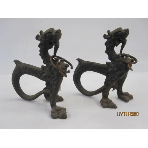 180 - Pair 19th century Asian cast metal model dragons with curved tails, 24cm high (2)