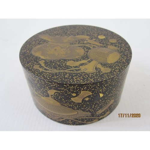 186 - Late 19th/early 20th century Japanese gilt decorated lacquer box, cylindrical and decorated with var... 