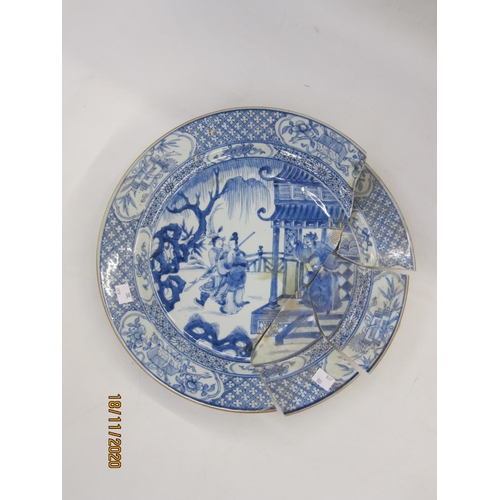 211 - 18th century Chinese porcelain charger with scene of skirmish and figures before a pagoda, having br... 