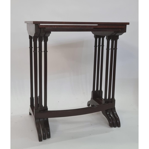 24 - 20th century mahogany nest of three tables, the banded tops above turned twin end pillar supports, c... 