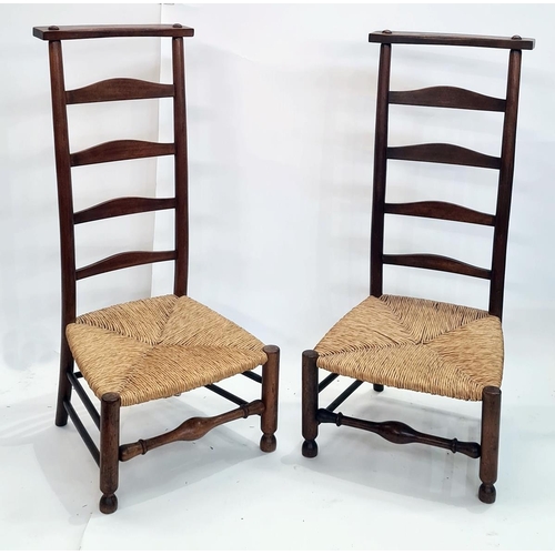 30 - Pair of 20th century rush seated ladderback country prie-dieu chairs with low seats, on turned suppo... 