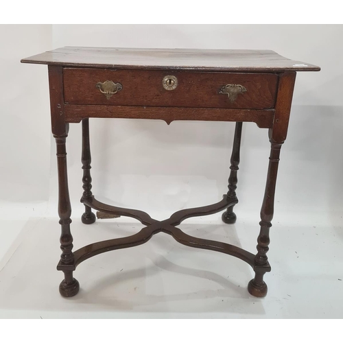 35 - Late 17th century oak lowboy with single frieze drawer and on slender baluster supports, with wavy s... 